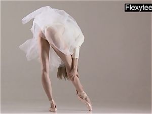 ash-blonde gymnast performs gymnastics