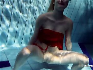 steamy platinum-blonde Lucie French teen in the pool
